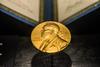 A golden image of the Nobel Prize decorates the front of the Science Museum in Singapore