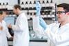 A photograph of a chemist working in a lab