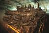 The hull of the Mary Rose, being preserved in a museum