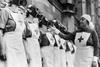 Nurses from the House of Lords Red Cross Detachment wearing gas masks,