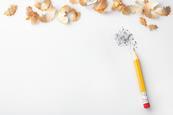 Pencil and sharpenings  on a white table