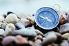 Magnetic compass on a pebble beach