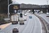 An image showing a motorway and a sign reading 'Freight to Eu new documents required'