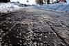 An icy footpath that has been gritted with rock salt