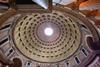 An interior photo of the grand domed roof the Roman Pantheon