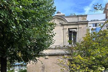 The exterior or a building with a courtyard garden