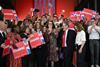 Keir Starmer celebrates with a crowd who are carrying placards that say CHANGE.