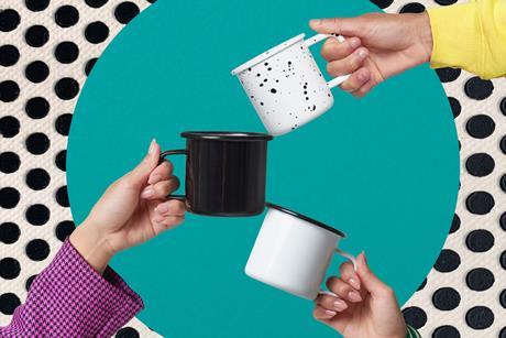 Three hands with a cup in each hand on a polka dot background